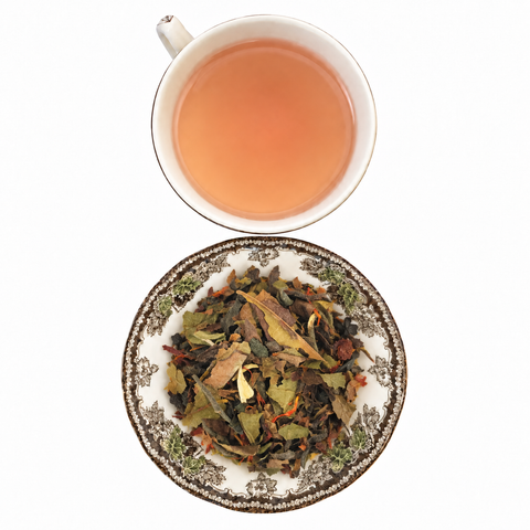 White Pomegranate Tea loose-leaf tea with brewed tea on a white background