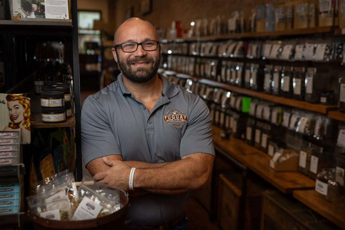 Fuquay Spice & Tea team member standing inside the store.