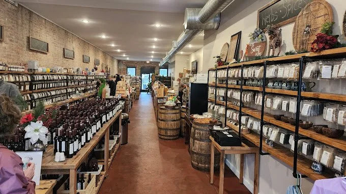 Inside Fuquay Spice & Tea with customers browsing the shelves.