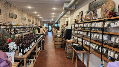 Inside Fuquay Spice & Tea with customers browsing the shelves.